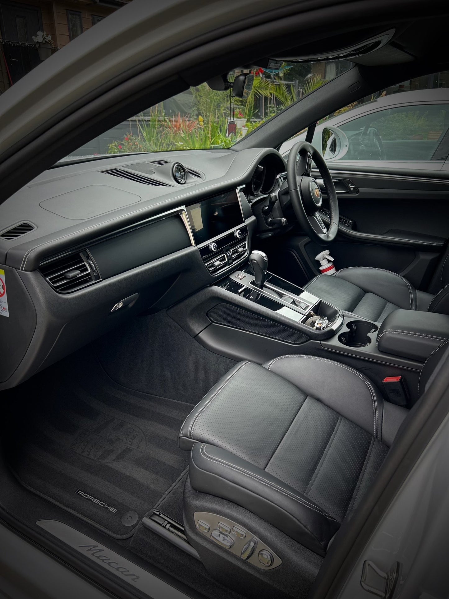 Porsche interior, macan, porsche stencil on carpets, stripes on carpet, leather seats nice and clean, looking brand new after car detailing in northamptonshire