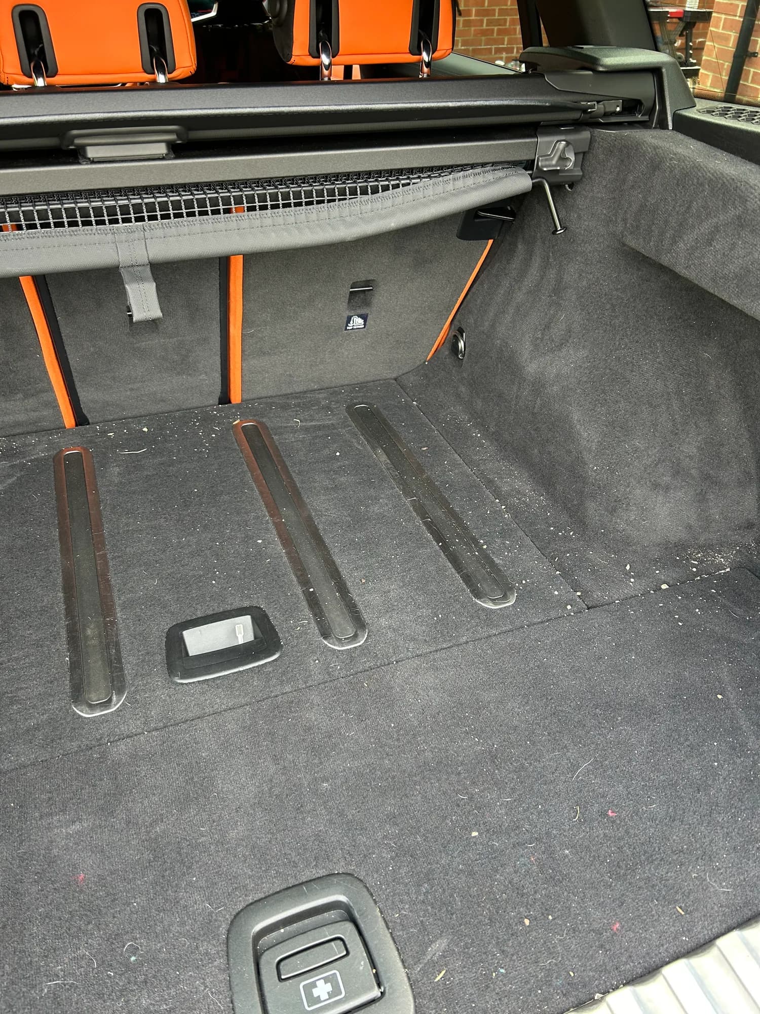 BMW M3 boot before cleaning, dirt worked into the carpet