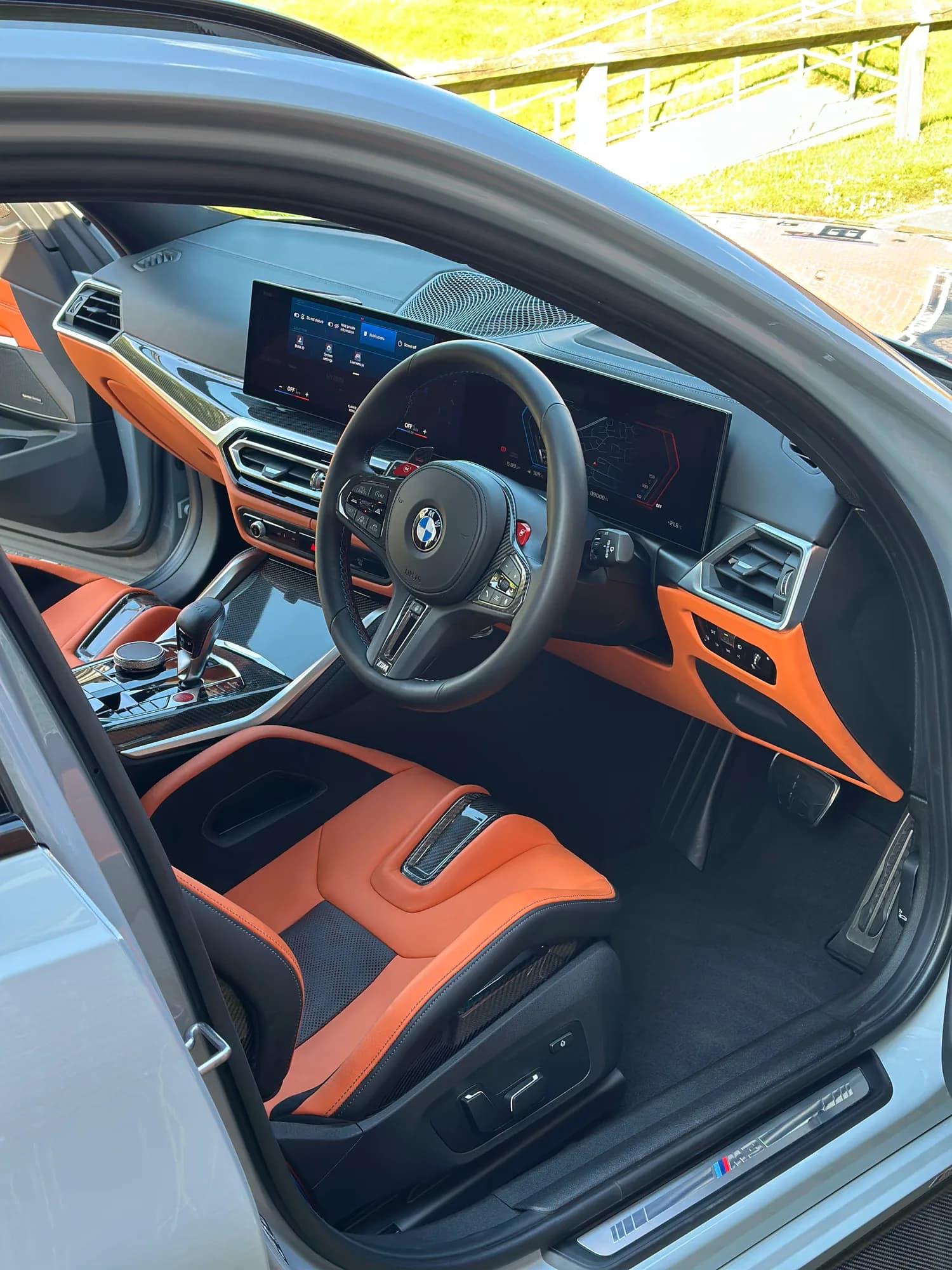 BMW M3 Touring interior in orange leather after a full valet