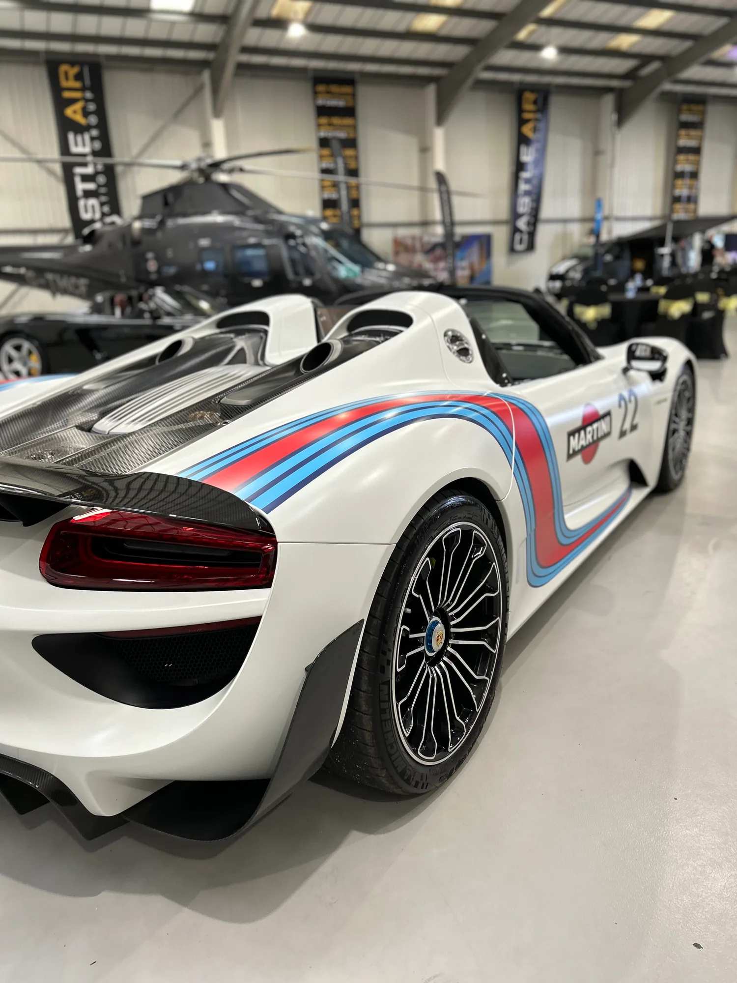 Porsche 918 Spyder in Martini livery being cleaned