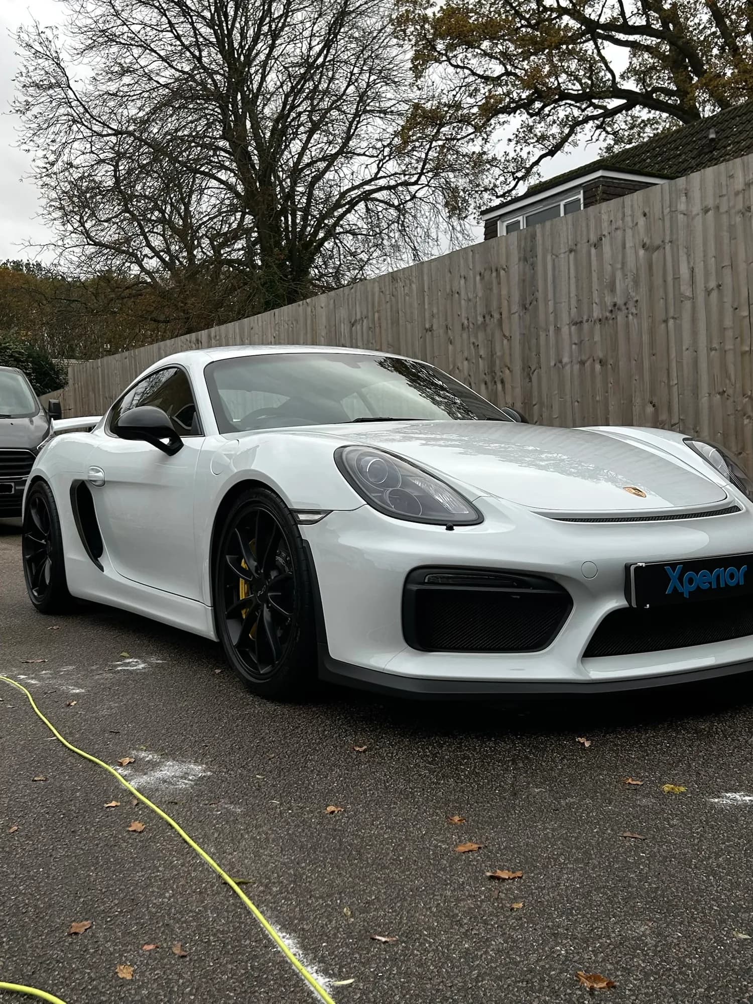 Porsche Cayman GT4 in white after a maintenance valet