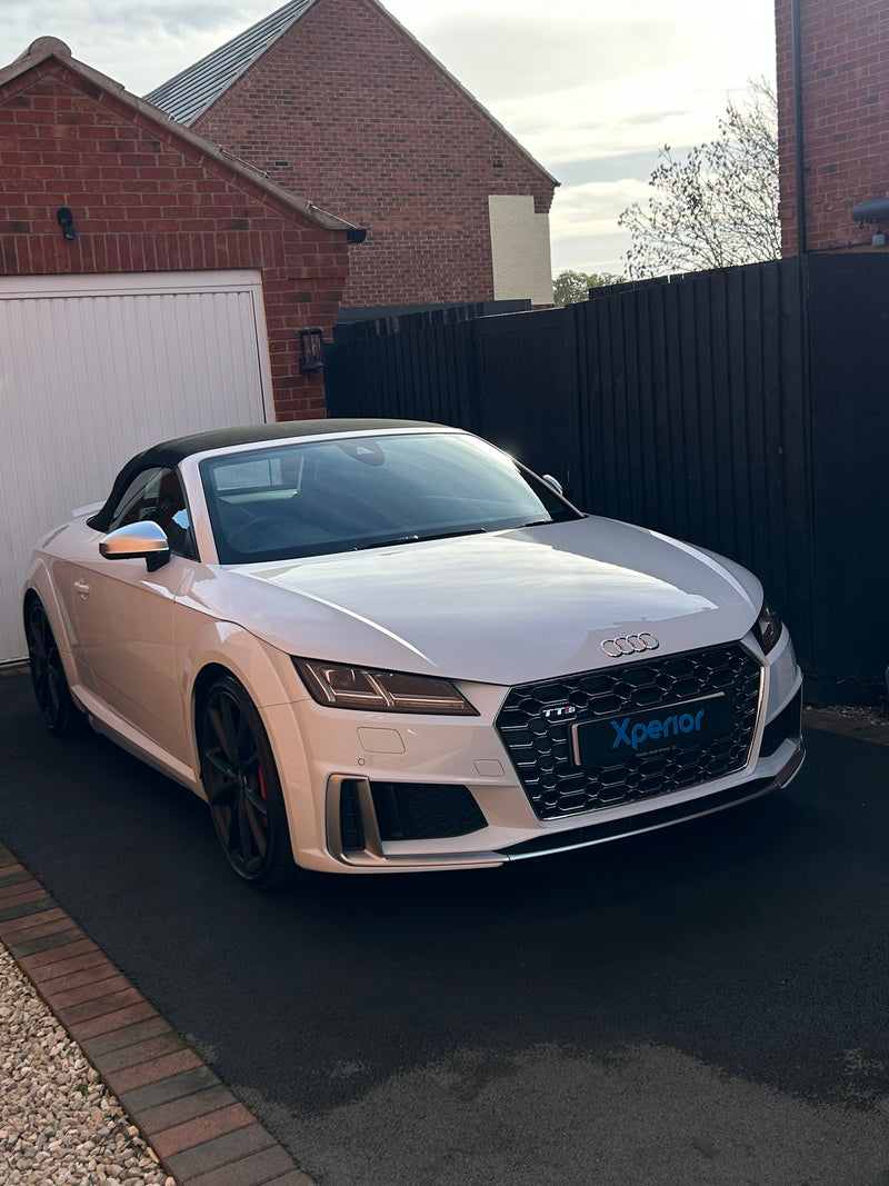 White car with black clean soft top, in factory condition after maintenance clean valet