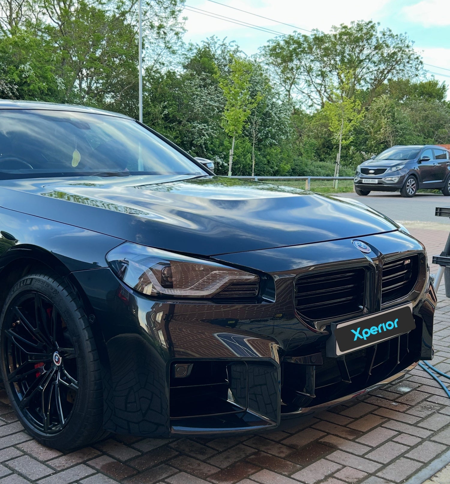 Black BMW M2 Sports Car front view after exterior valeting 