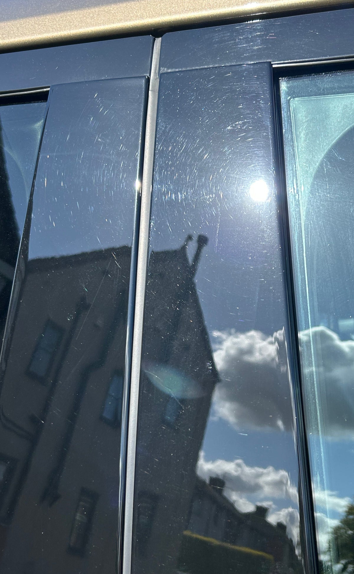 Piano black trims on land rover defender with a lot of swirls and scratches