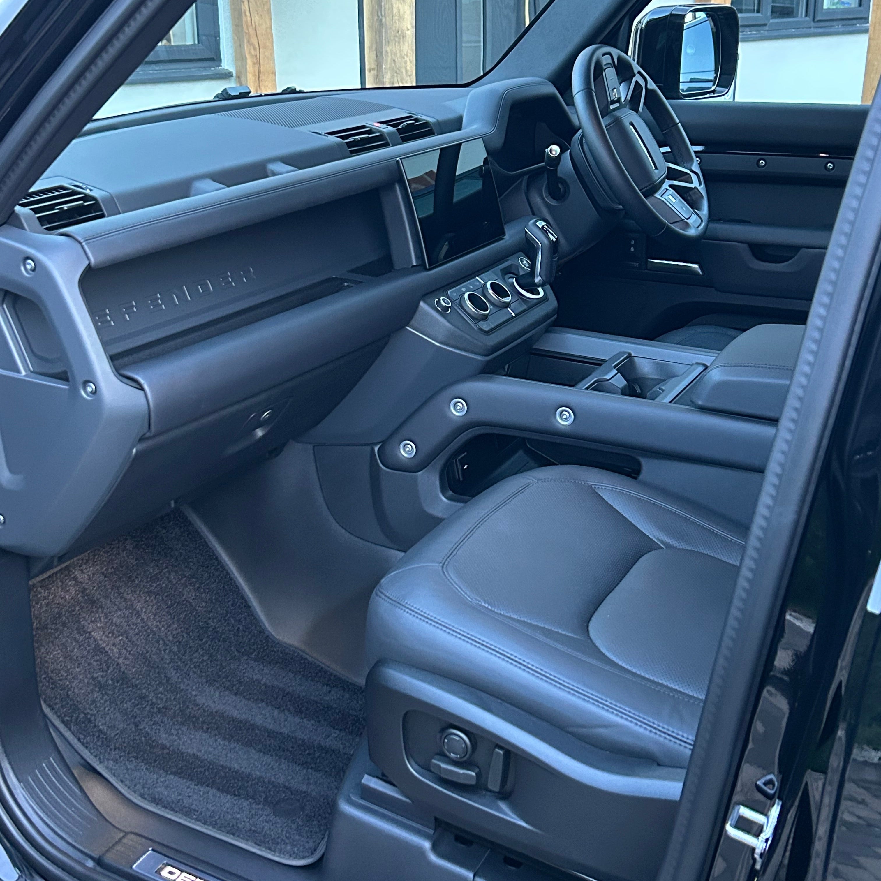 Interior of a vehicle with a focus on the driver's seat and dashboard after interior valeting