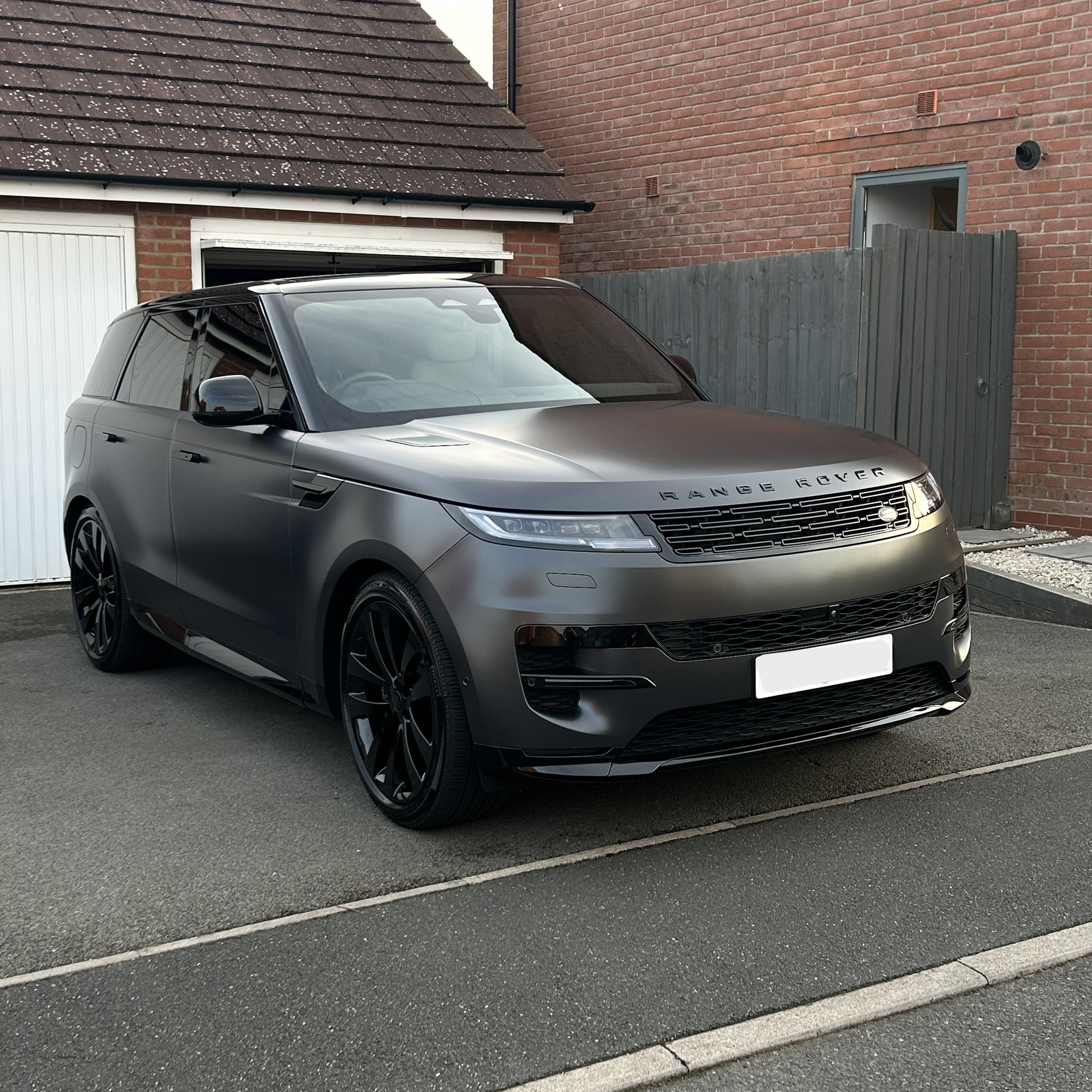 Gray Range Rover parked in a driveway after maintenance valeting clean