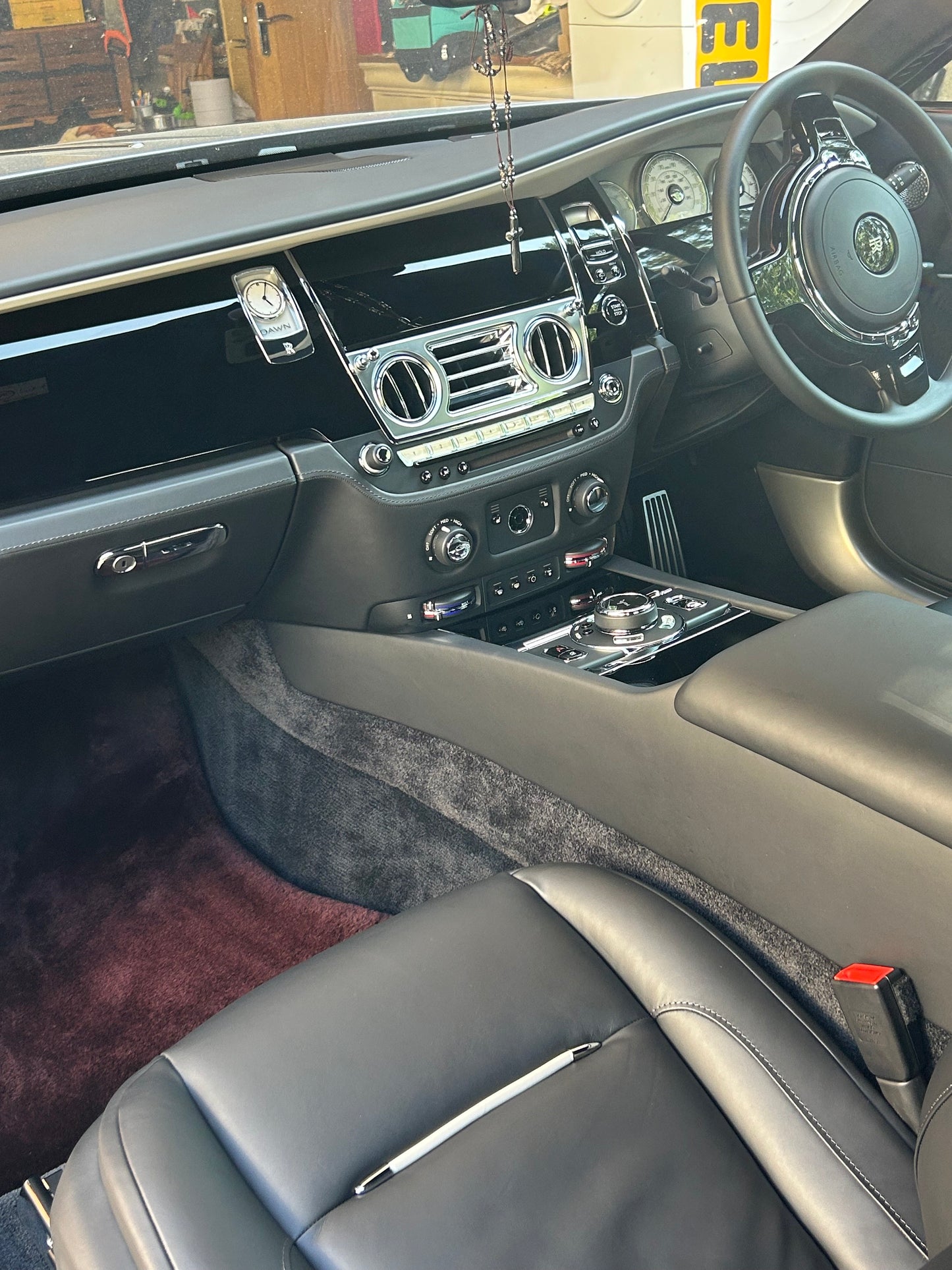 detailed Rolls-Royce interior featuring clean leather seats and polished gloss black trim by Xperior Detailing in Northampton